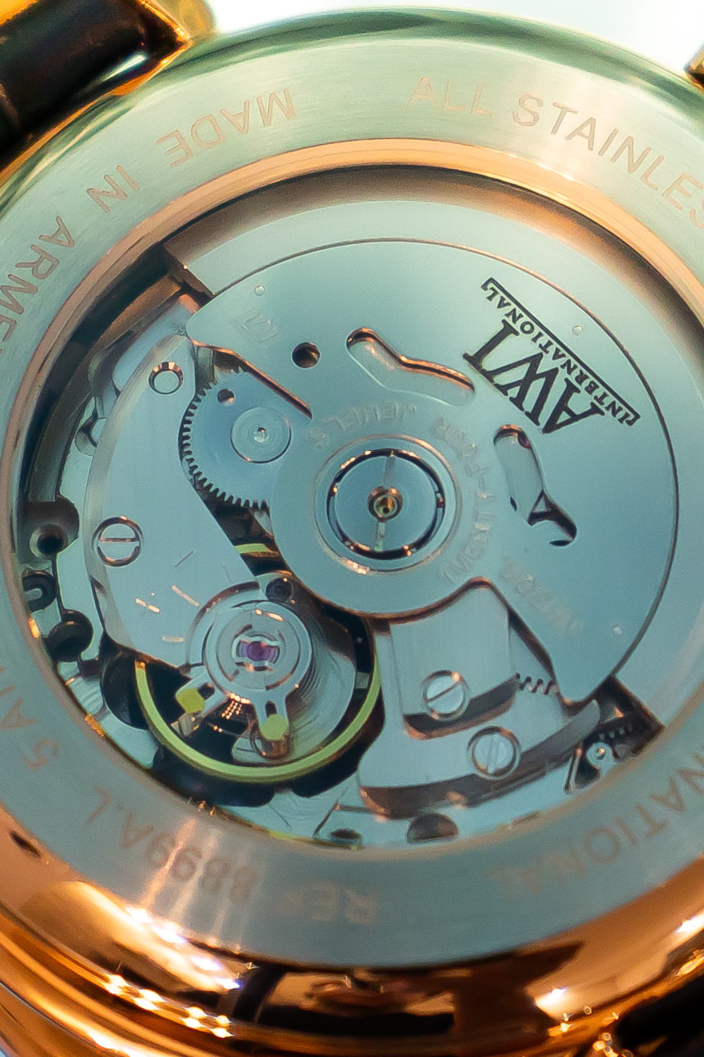 A blue guilloché AWI dial with Roman numerals and an open balance wheel