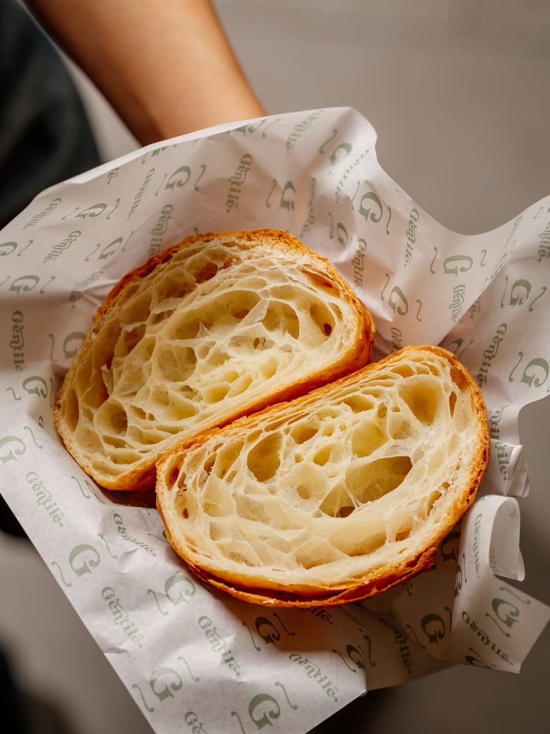 A croissant in branded Gentile paper
