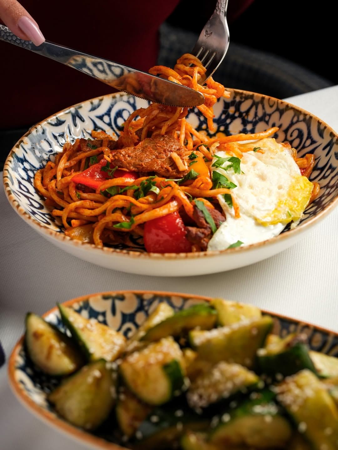 Lagman up close with a fried cucumber salad